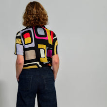 Load image into Gallery viewer, back view Sixties short sleeve shirt black fushia gold lilac and red abstract print

